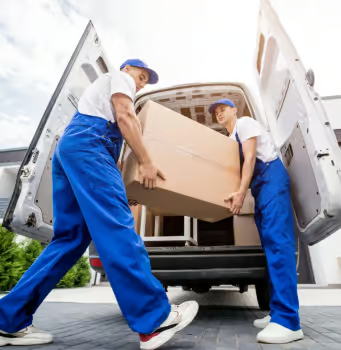 Experienced movers carefully transporting heavy furniture